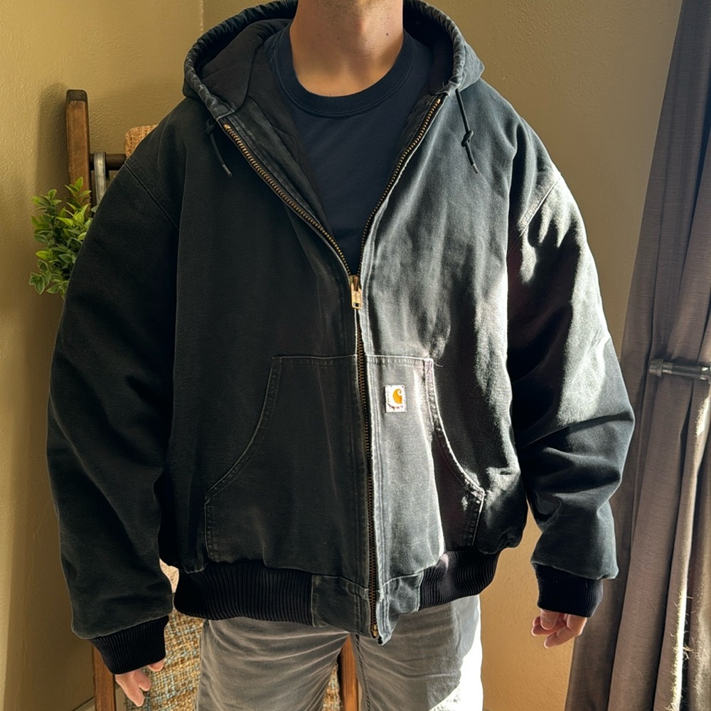 Black Carhartt workcoat made in USA fits like a 2XL